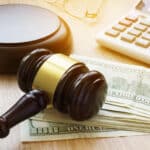 Fraudulent Class Action Claims Lead to Conviction and Restitution Review